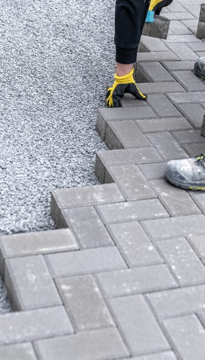 bricklayer-industrial-worker-installing-brick-masonry